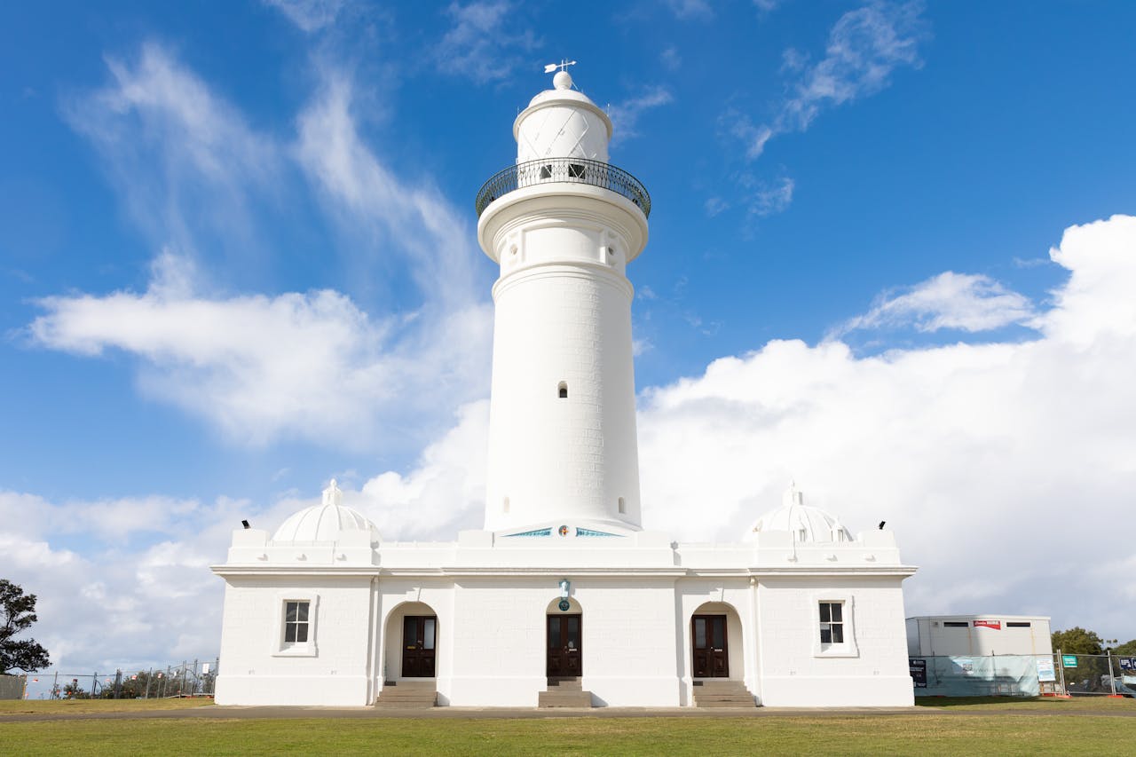 Macquarie Lighthouse in Sydney, a heritage landmark under a clear blue sky.